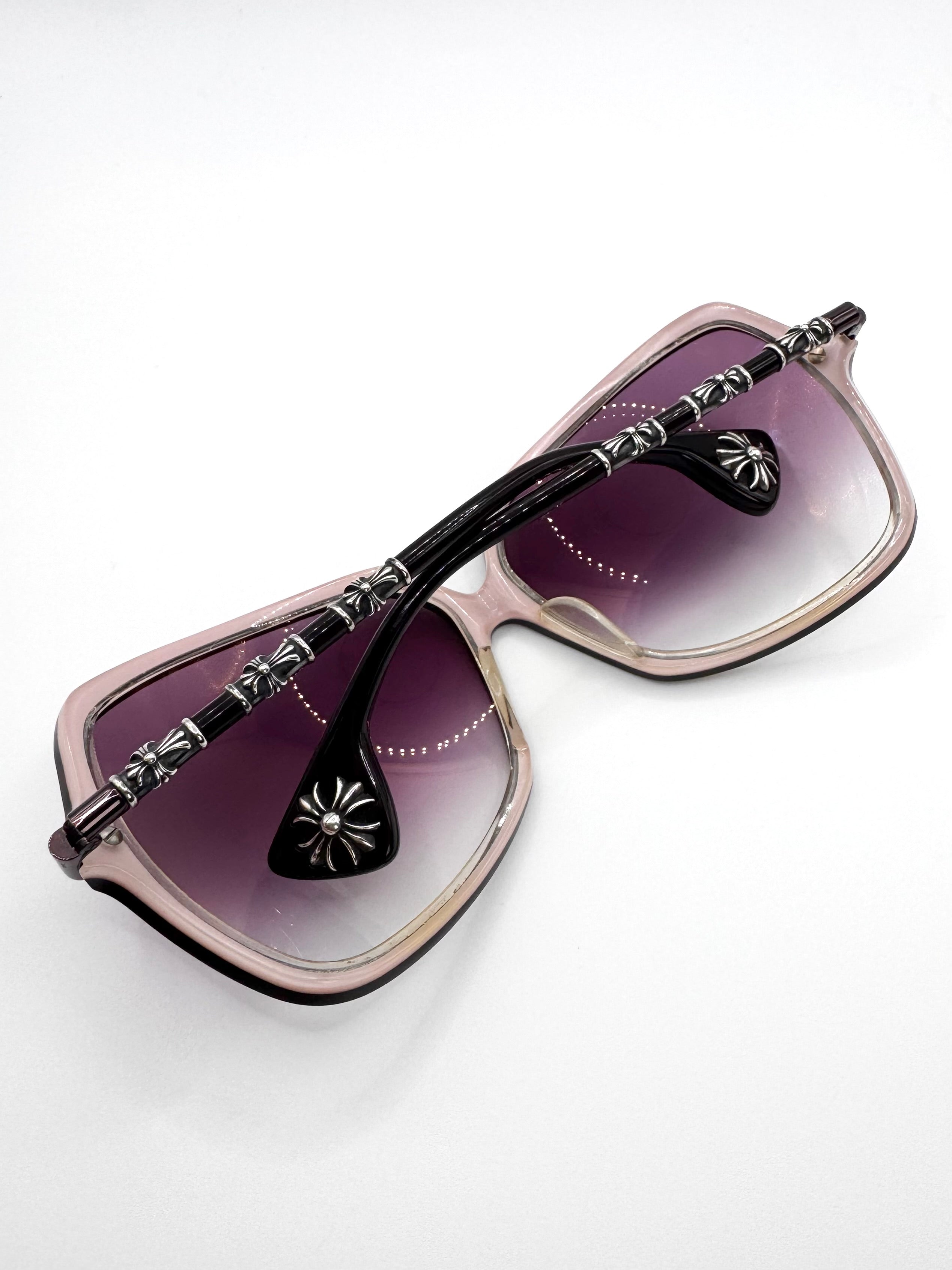 Chrome Hearts “Iku Iku” oversized square sunglasses with gradient purple lenses, black and translucent frame, and sterling silver cross hardware on temples displayed on white background.