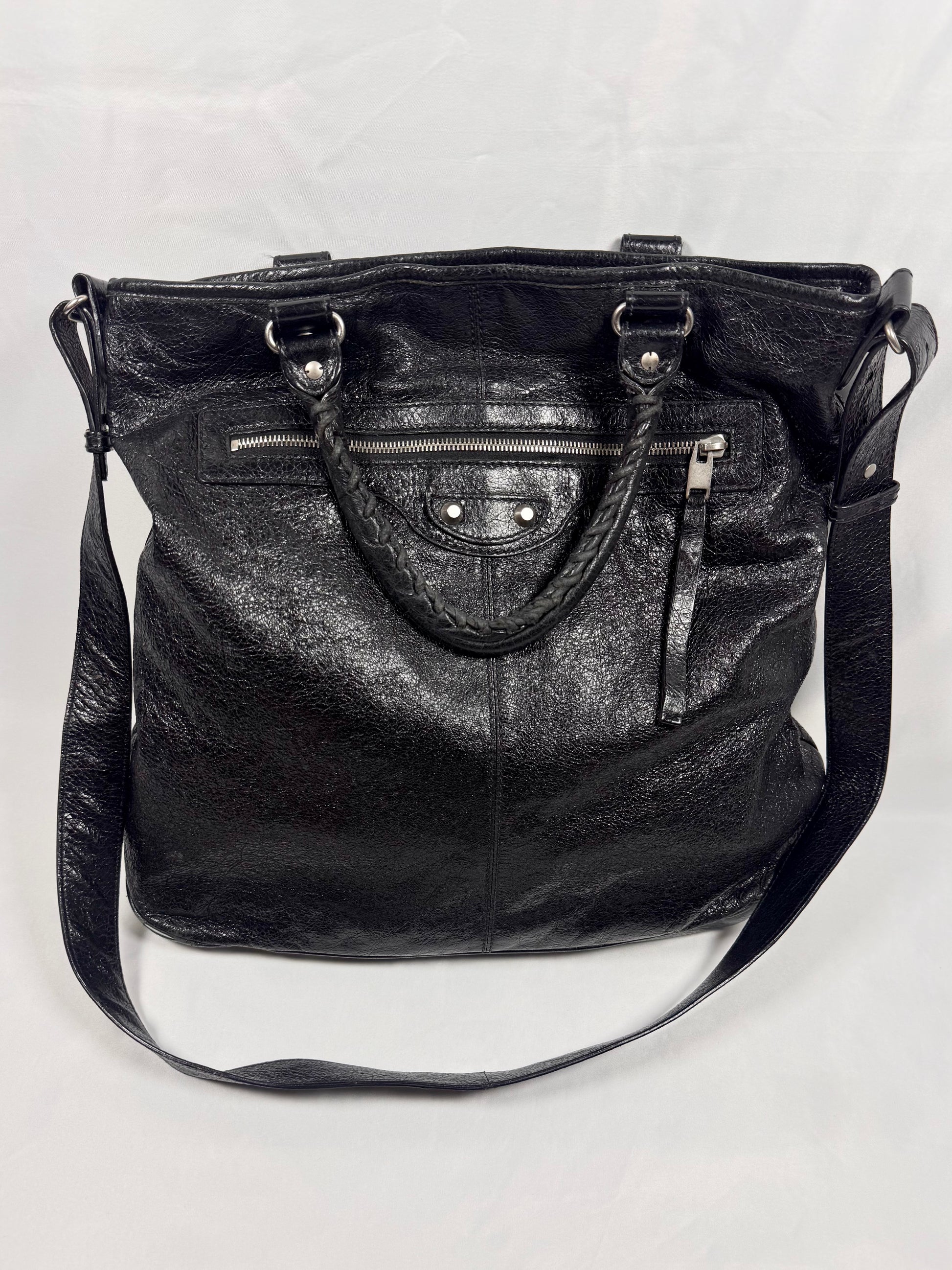 Balenciaga Motocross City black calfskin leather crossbody bag with shoulder strap On white background 