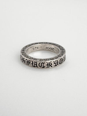 Classic chrome hearts ring in silver with the ‘fuck you’ embroidery along with signature cross motifs on a 3 mm spacer ring.