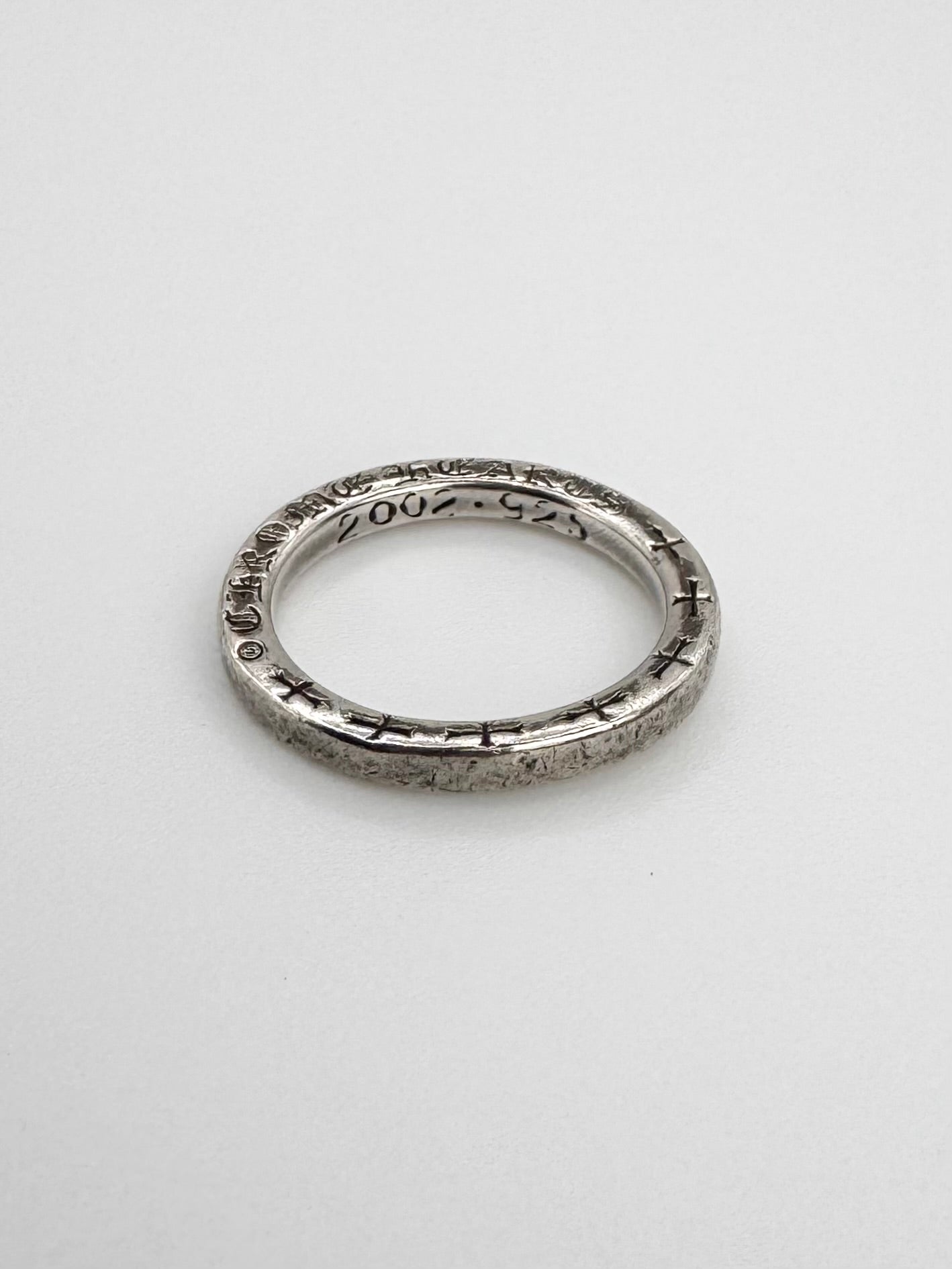 Chrome hearts ring with gothic logo engraving on a skinny band sterling silver spacer ring 