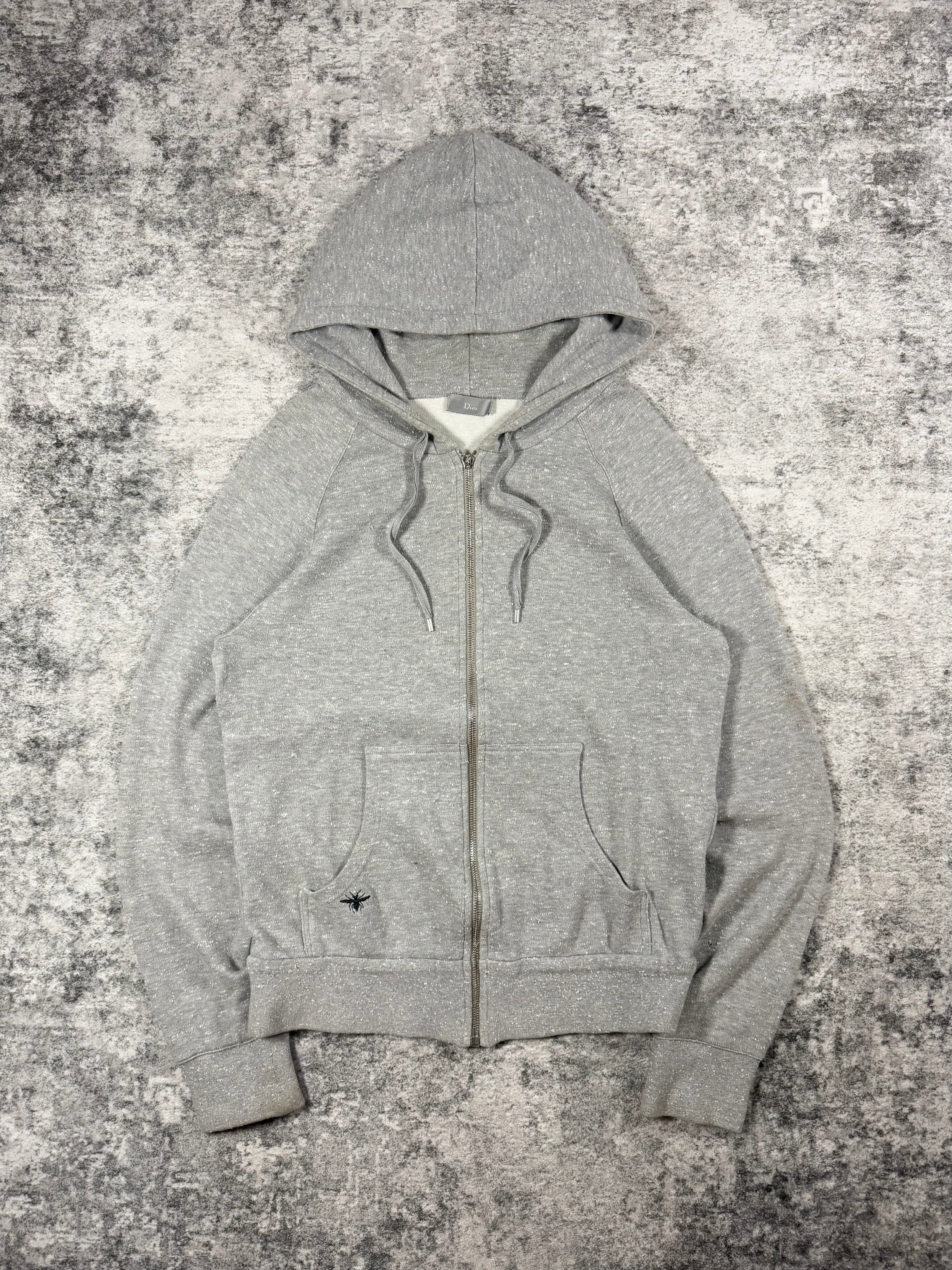 Early 2010s Dior Homme Kris Van Assche heather grey zip-up hoodie with black bee embroidery detail and slim silhouette.