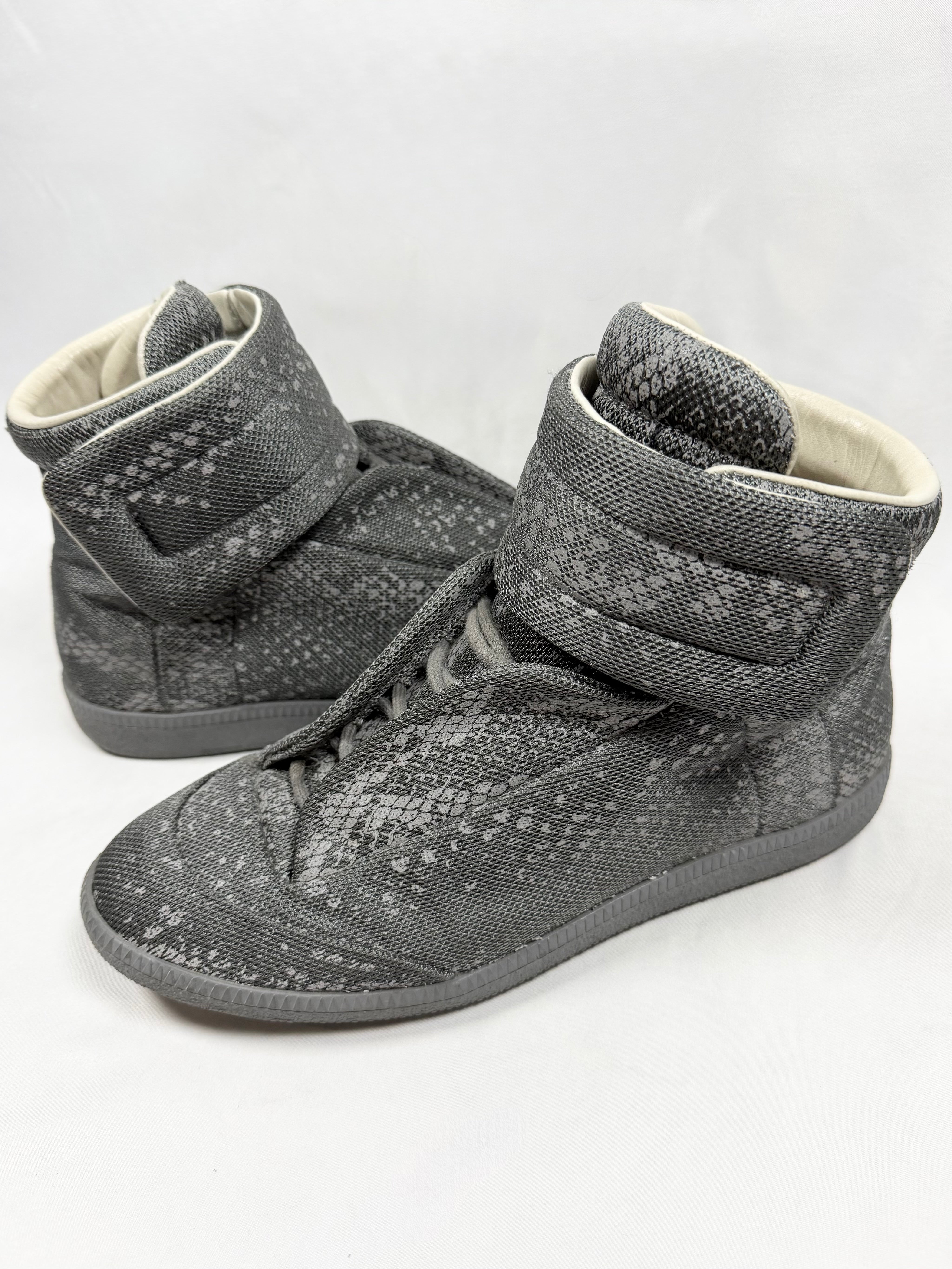 Maison Margiela Reflective Python Future High grey 3M sneakers with velcro strap and textured reptile pattern shown in studio lighting