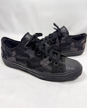 Number (N)ine Takahiro Miyashita crying heart patchwork sneakers side profile on white background. 
