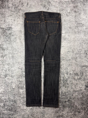 Number (N)ine raw denim from the Fall/Winter 2007 collection coming in a charcoal wash with intricate stitching details and signature crying heart patch showcased on grey background. 