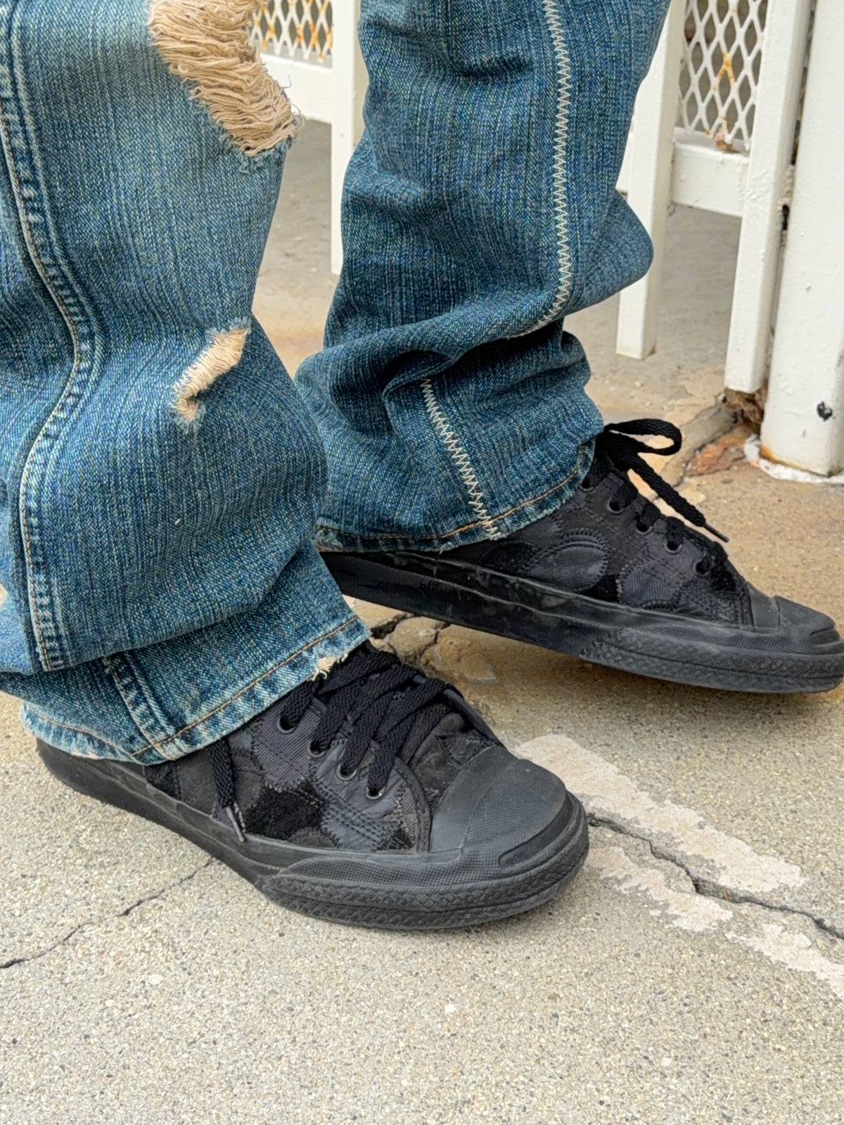 Number (N)ine mixed leather and textile heart patchwork with zigzag stitching worn on feet