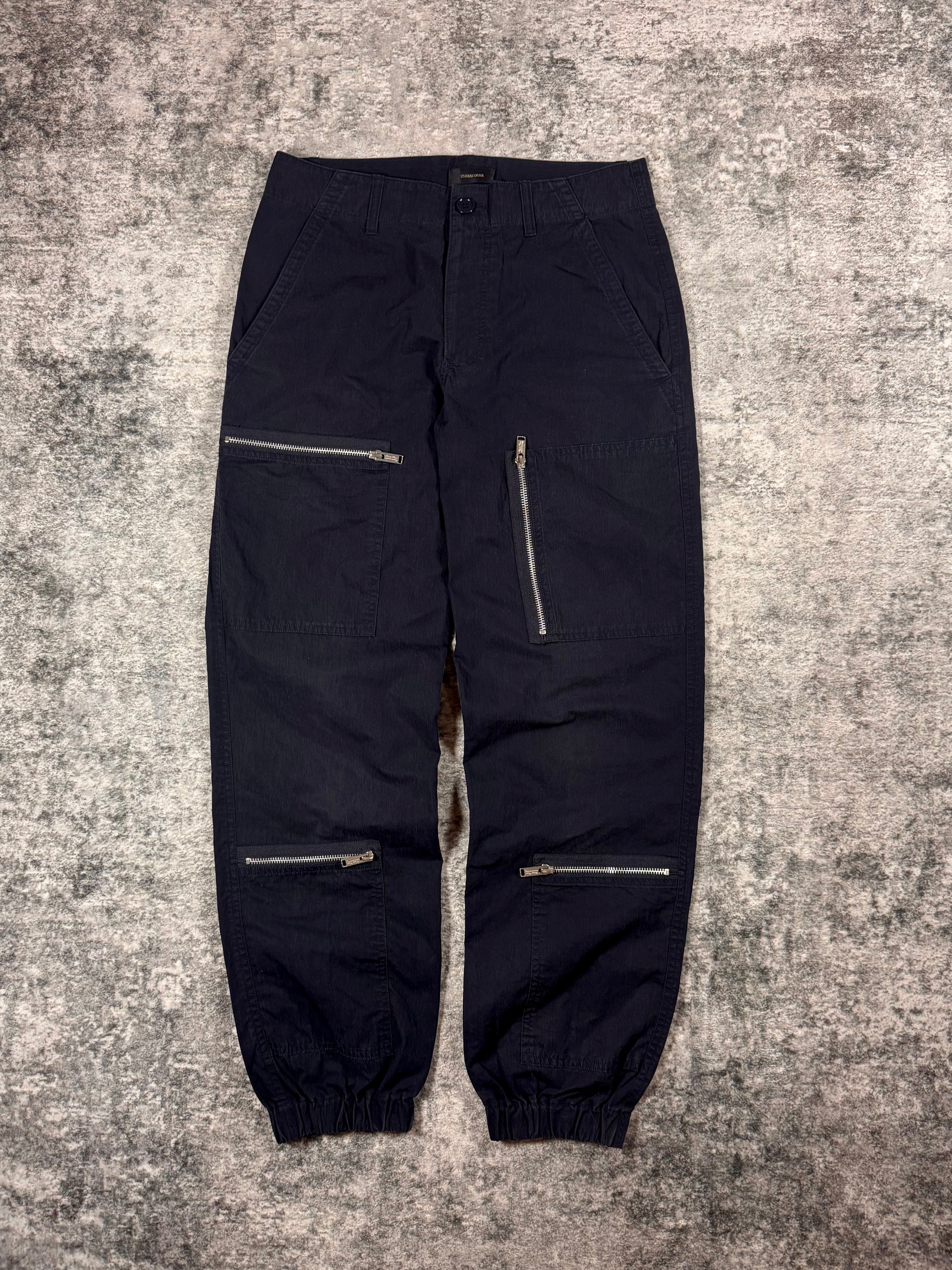 Undercover black multi-zip cargo pants front view
