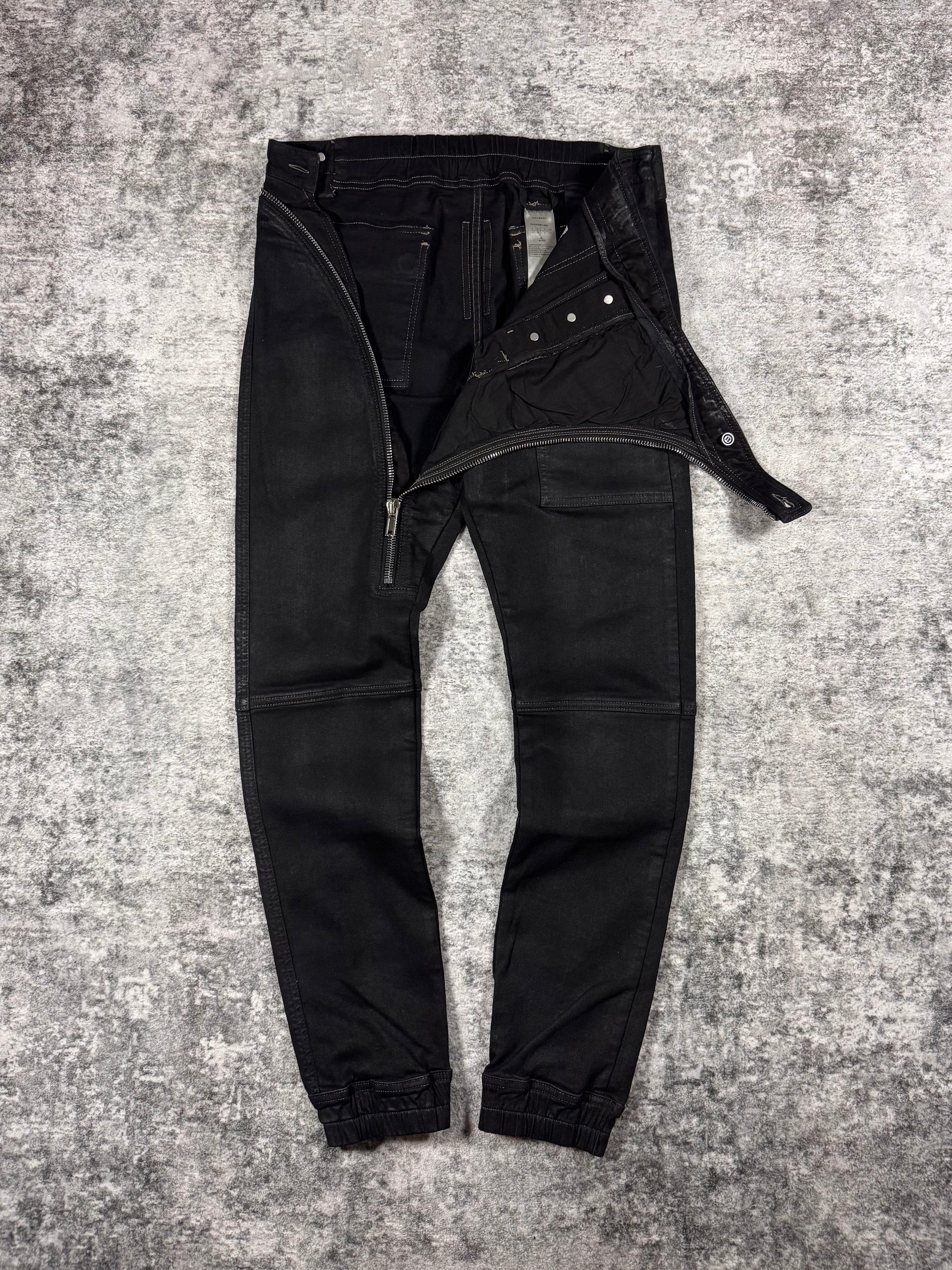 Rick Owens pants with a asymmetrical zipper fly that exposes the entire front side of the pants