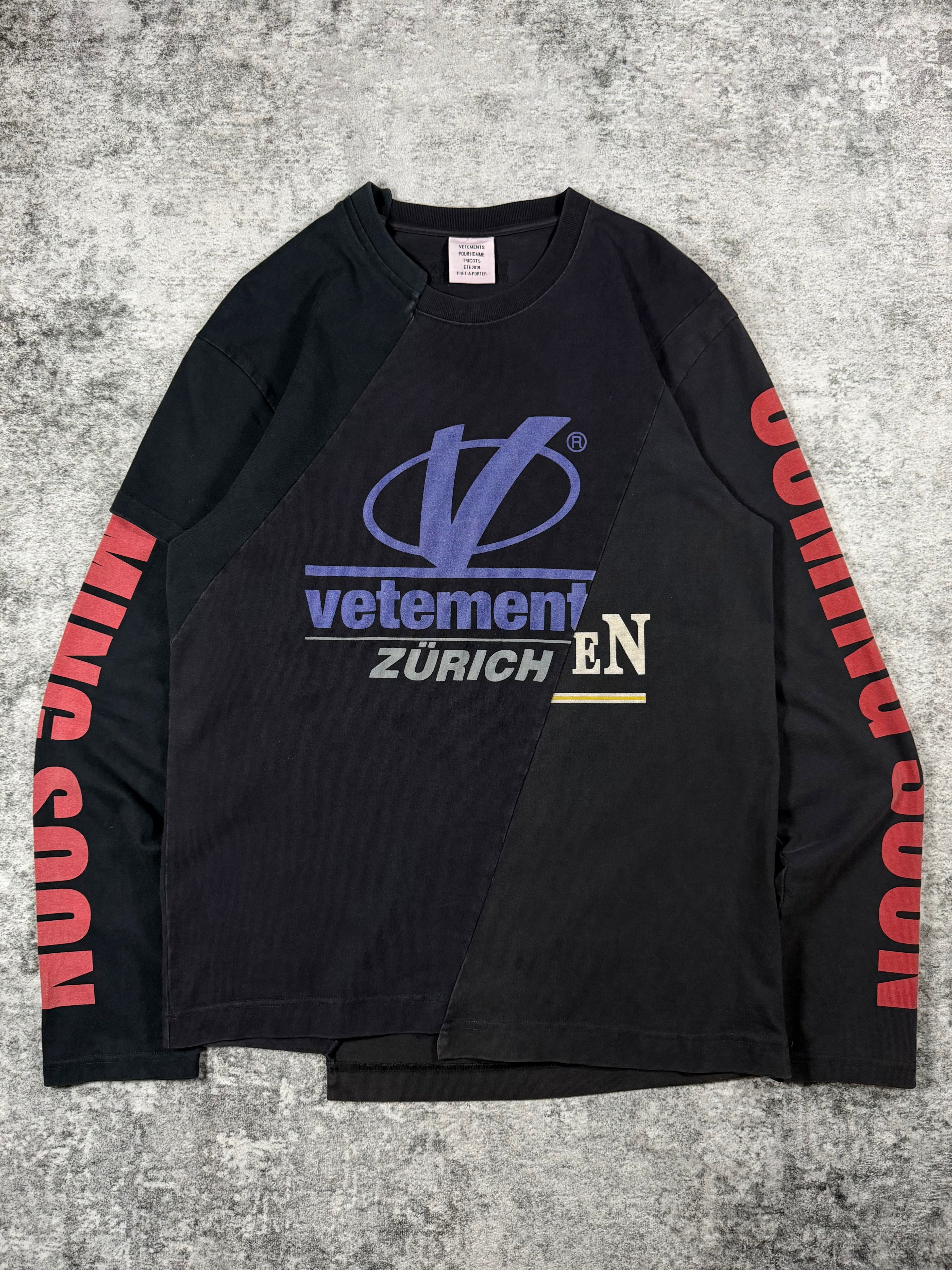 Vetements black reconstructed longsleeve from spring summer 2018 with paneled graphics and “coming soon” sleeve hit. 
